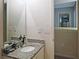 Bathroom showcasing a granite countertop, vanity, and a large mirror at 23 Oxford Ln, Kingston, GA 30145