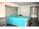 Bright bedroom with a decorative headboard and matching side tables, creating a cozy space at 23 Oxford Ln, Kingston, GA 30145