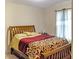 Bedroom showcasing a wood frame bed, soft bedding, and natural light at 23 Oxford Ln, Kingston, GA 30145