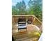 Secluded backyard deck with patio furniture and a view of the trees at 23 Oxford Ln, Kingston, GA 30145