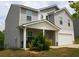 Charming two-story home featuring a gray exterior, attached garage, and well-maintained front yard at 23 Oxford Ln, Kingston, GA 30145