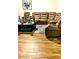 Cozy living room boasting a sectional sofa, modern coffee table, and stylish décor at 23 Oxford Ln, Kingston, GA 30145