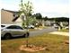 A quiet residential street featuring a variety of well-maintained homes and parked cars at 23 Oxford Ln, Kingston, GA 30145