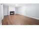 Basement featuring a white-painted brick fireplace and stylish wood flooring at 2352 S Hairston Rd, Decatur, GA 30035