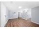 Basement with wood floors, white doors, and doorways leading to other spaces at 2352 S Hairston Rd, Decatur, GA 30035