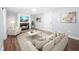 Comfortable basement with a brick fireplace, a cozy seating area, and a television at 2352 S Hairston Rd, Decatur, GA 30035