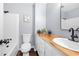 Bright bathroom features a shower and a sink with wood countertop at 2352 S Hairston Rd, Decatur, GA 30035