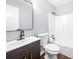 This bathroom features a shower and a modern sink with dark wood vanity at 2352 S Hairston Rd, Decatur, GA 30035