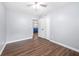 A bedroom with wood-look floors, a closet, and views to the kitchen, providing a comfortable living space at 2352 S Hairston Rd, Decatur, GA 30035