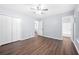 Light-filled bedroom with hardwood flooring, a double door closet, and neutral walls at 2352 S Hairston Rd, Decatur, GA 30035