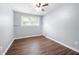 Bedroom features neutral paint, ceiling fan, and wood-look flooring at 2352 S Hairston Rd, Decatur, GA 30035