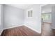Bright, freshly painted bedroom featuring stylish brown flooring and abundant natural light at 2352 S Hairston Rd, Decatur, GA 30035