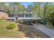 Charming home exterior with manicured landscaping, a carport, and inviting curb appeal at 2352 S Hairston Rd, Decatur, GA 30035