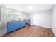 A kitchen features blue cabinets, butcher block countertops, stainless steel oven, and wood-look flooring at 2352 S Hairston Rd, Decatur, GA 30035