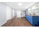 This kitchenette has blue cabinets, butcher block countertops, and wood-look flooring at 2352 S Hairston Rd, Decatur, GA 30035