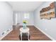 Spacious living room with wood-look flooring, modern artwork, and ample natural light at 2352 S Hairston Rd, Decatur, GA 30035