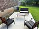Cozy back patio featuring outdoor furniture and a peaceful setting at 2512 Montezuma Cir, Ellenwood, GA 30294