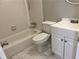 Bright bathroom with subway tile surround, white vanity, and marble-look tile flooring at 2512 Montezuma Cir, Ellenwood, GA 30294