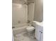 Bright bathroom with subway tile surround, white vanity, and marble-look tile flooring at 2512 Montezuma Cir, Ellenwood, GA 30294