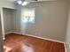 Bedroom with wood floors, closet, and a window, offering functional space at 2512 Montezuma Cir, Ellenwood, GA 30294
