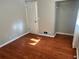 Bright bedroom with hardwood floors and a closet at 2512 Montezuma Cir, Ellenwood, GA 30294
