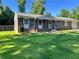Charming brick home with well-manicured lawn and inviting front porch at 2512 Montezuma Cir, Ellenwood, GA 30294