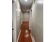Long hallway with hardwood floors at 2512 Montezuma Cir, Ellenwood, GA 30294