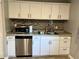 Lovely kitchen featuring stainless steel appliances, ample counter space, and modern hardware at 2512 Montezuma Cir, Ellenwood, GA 30294