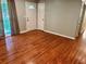 Cozy living room with hardwood floors, natural light, and ample space at 2512 Montezuma Cir, Ellenwood, GA 30294