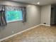 Inviting living room with tile floors, large windows, and lots of natural light at 2512 Montezuma Cir, Ellenwood, GA 30294