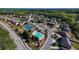 An aerial view shows community tennis courts and a pool in a neighborhood setting at 3228 Trinity Mill Cir, Dacula, GA 30019