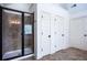Modern bathroom featuring glass shower with tile surround and three white linen closets at 3228 Trinity Mill Cir, Dacula, GA 30019