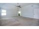 Spacious bedroom with neutral carpet, ample natural light, and en suite bathroom at 3228 Trinity Mill Cir, Dacula, GA 30019