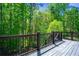 Wood deck offering beautiful views of lush green trees at 3228 Trinity Mill Cir, Dacula, GA 30019