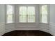 Cozy dining nook with a bay window and dark hardwood floors at 3228 Trinity Mill Cir, Dacula, GA 30019