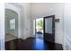 Elegant foyer with hardwood floors, high ceilings, and an arched doorway at 3228 Trinity Mill Cir, Dacula, GA 30019