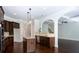 Spacious open kitchen with island, stainless steel appliances, and dark wood cabinets at 3228 Trinity Mill Cir, Dacula, GA 30019