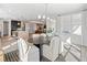 Open dining area featuring an oval table, white upholstered chairs, and lots of natural light at 5395 Keepsake Court, Cumming, GA 30040