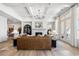 Beautiful living room with a fireplace, coffered ceilings, and large windows at 5395 Keepsake Court, Cumming, GA 30040