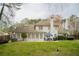 Spacious backyard features a patio, outdoor dining area, and well-maintained lawn ideal for entertaining at 5713 Brynwood Nw Cir, Acworth, GA 30101