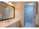 Well-lit bathroom featuring a vanity with a mirror and a shower at 5713 Brynwood Nw Cir, Acworth, GA 30101