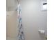 Bathroom featuring a shower with a patterned curtain and a small window for natural light at 5713 Brynwood Nw Cir, Acworth, GA 30101
