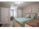 Comfortable bedroom with neutral walls and a plush unicorn stuffed animal on the bed at 5713 Brynwood Nw Cir, Acworth, GA 30101