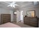 Comfortable bedroom with a ceiling fan, wall-mounted TV, and view of an open doorway at 5713 Brynwood Nw Cir, Acworth, GA 30101