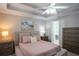 Well-lit bedroom showcases a bed with a padded headboard and stylish bedside tables at 5713 Brynwood Nw Cir, Acworth, GA 30101