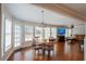 Sunlit breakfast nook open to living area with great natural light and wood floors at 5713 Brynwood Nw Cir, Acworth, GA 30101