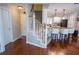 Inviting entryway featuring hardwood floors, stairs to the second level, and an open view of the kitchen at 5713 Brynwood Nw Cir, Acworth, GA 30101