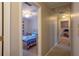 Hallway view into a bedroom with blue bedding, and an office space with a computer at 5713 Brynwood Nw Cir, Acworth, GA 30101