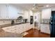 Bright kitchen featuring granite countertops, white cabinets, and stainless appliances at 5713 Brynwood Nw Cir, Acworth, GA 30101