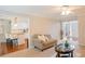 Open-concept living space with view to kitchen and hardwood floors at 5713 Brynwood Nw Cir, Acworth, GA 30101